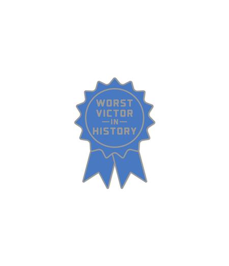 THE HUNGER GAMES WORST VICTOR IN HISTORY ENAMEL PIN